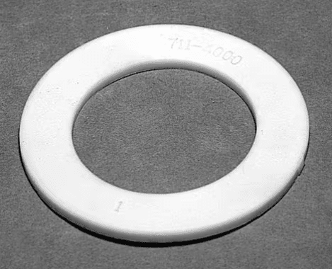 White circular plastic ring with Waterway 711-4000 1.5 Inch Union Heater Gasket embossed on top, resting on a gray background.